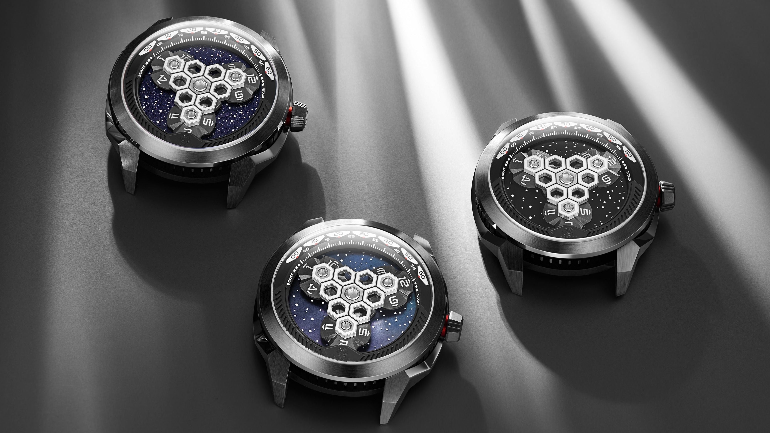 Three futuristic-looking watches with unique designs on a dark surface